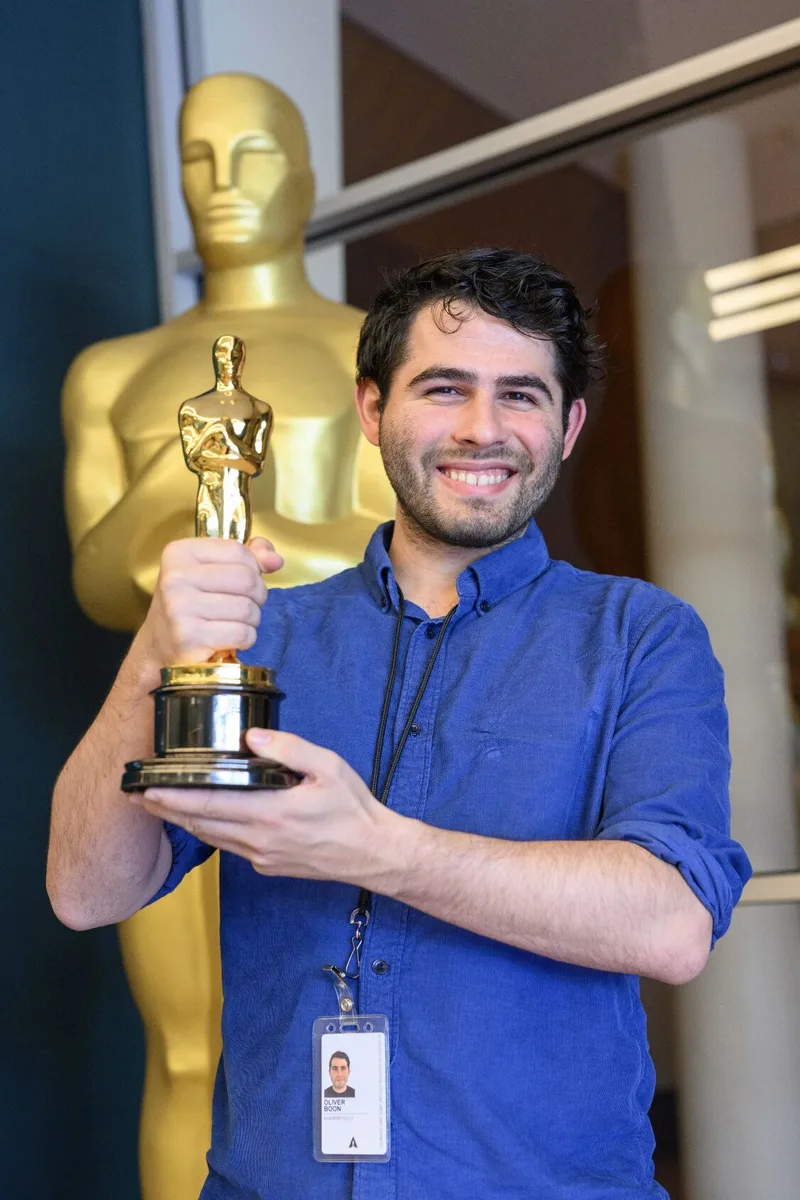 Oliver Boon with an Academy Award statue